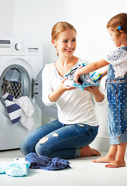 Washing machine repair expert fixing a top-load washer in Bengaluru